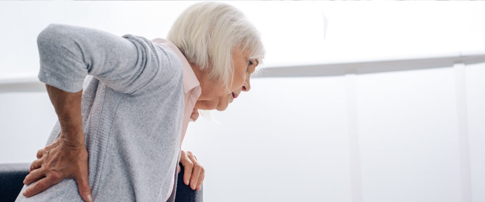 Older woman with acute lower back pain