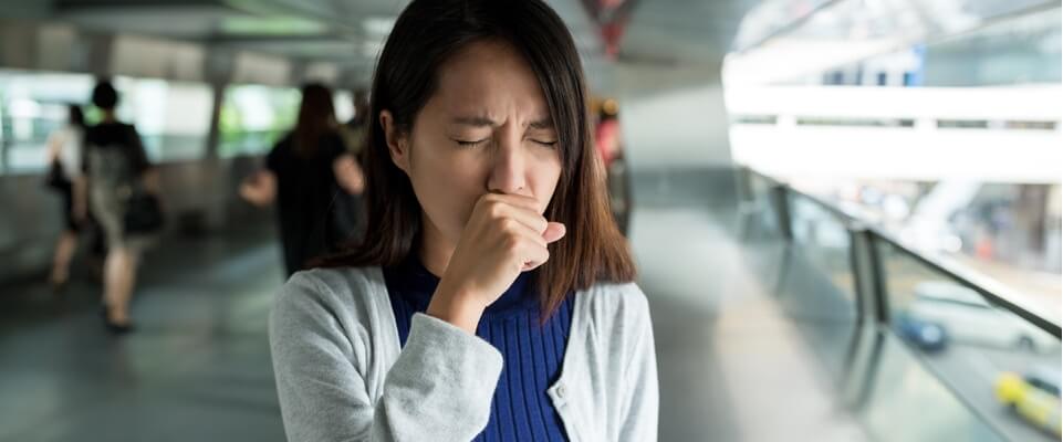 Woman with her hand to her face