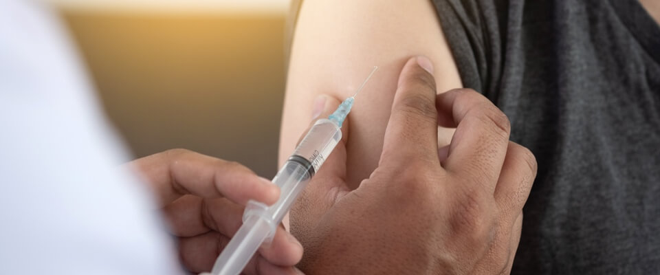 Shot being given in a person's arm