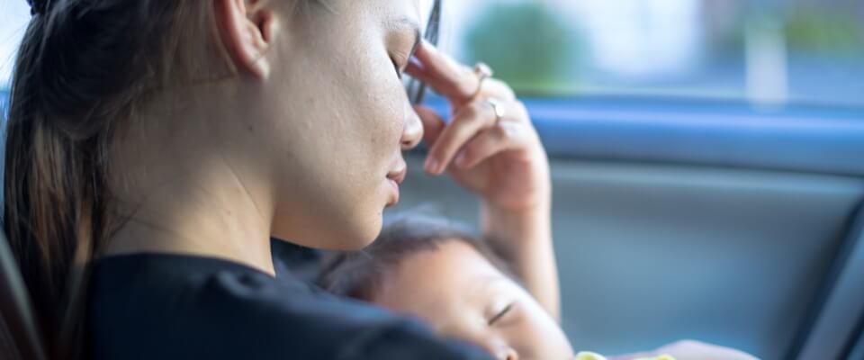 Depressed woman holding baby