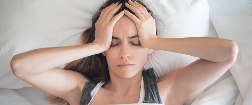 Woman lying in bed