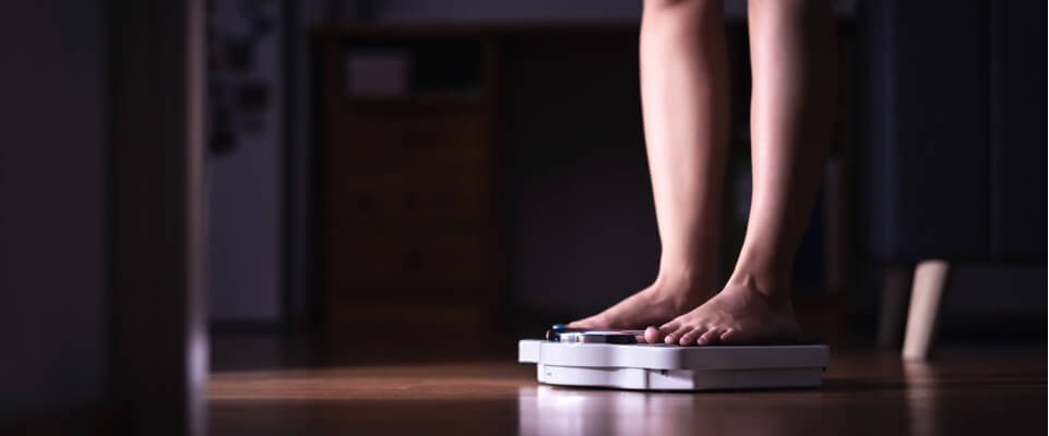 Woman looking at her weight