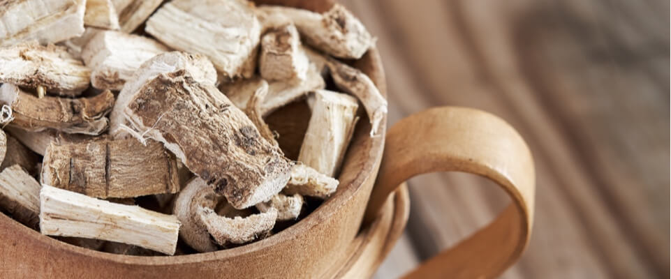 Coffee mug filled with wood chips.
