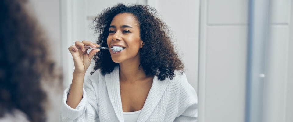 Woman brushing teeth